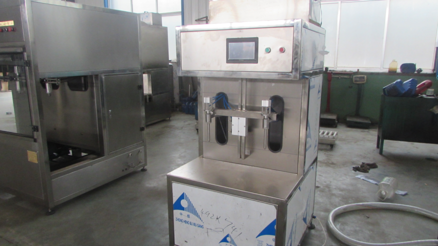 Máy chiết rót 2 vòi bán tự động - kiểu tự chảy